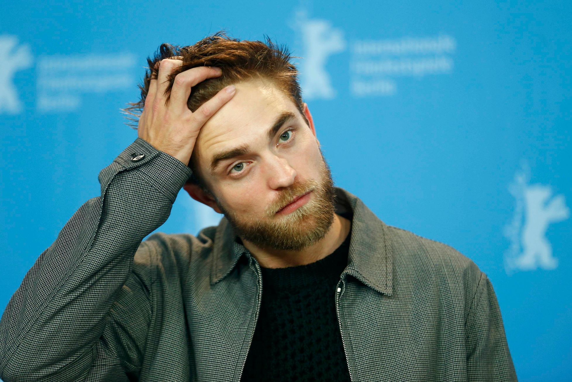 Actor Robert Pattinson poses during photocall at 65th Berlinale International Film Festival in Berlin