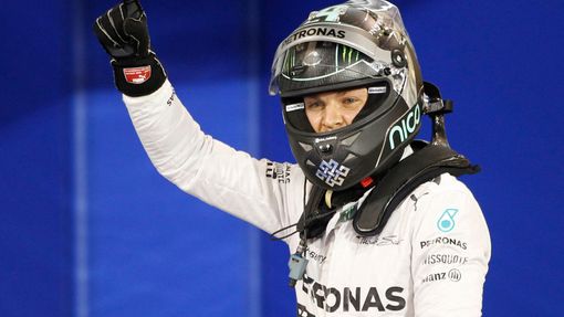 Mercedes Formula One driver Nico Rosberg of Germany celebrates after taking pole position at the qualifying session of the Bahrain F1 Grand Prix at the Bahrain Internatio