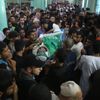 Mourners carry the body of a Hamas militant during his funeral in Rafah in the southern Gaza Strip