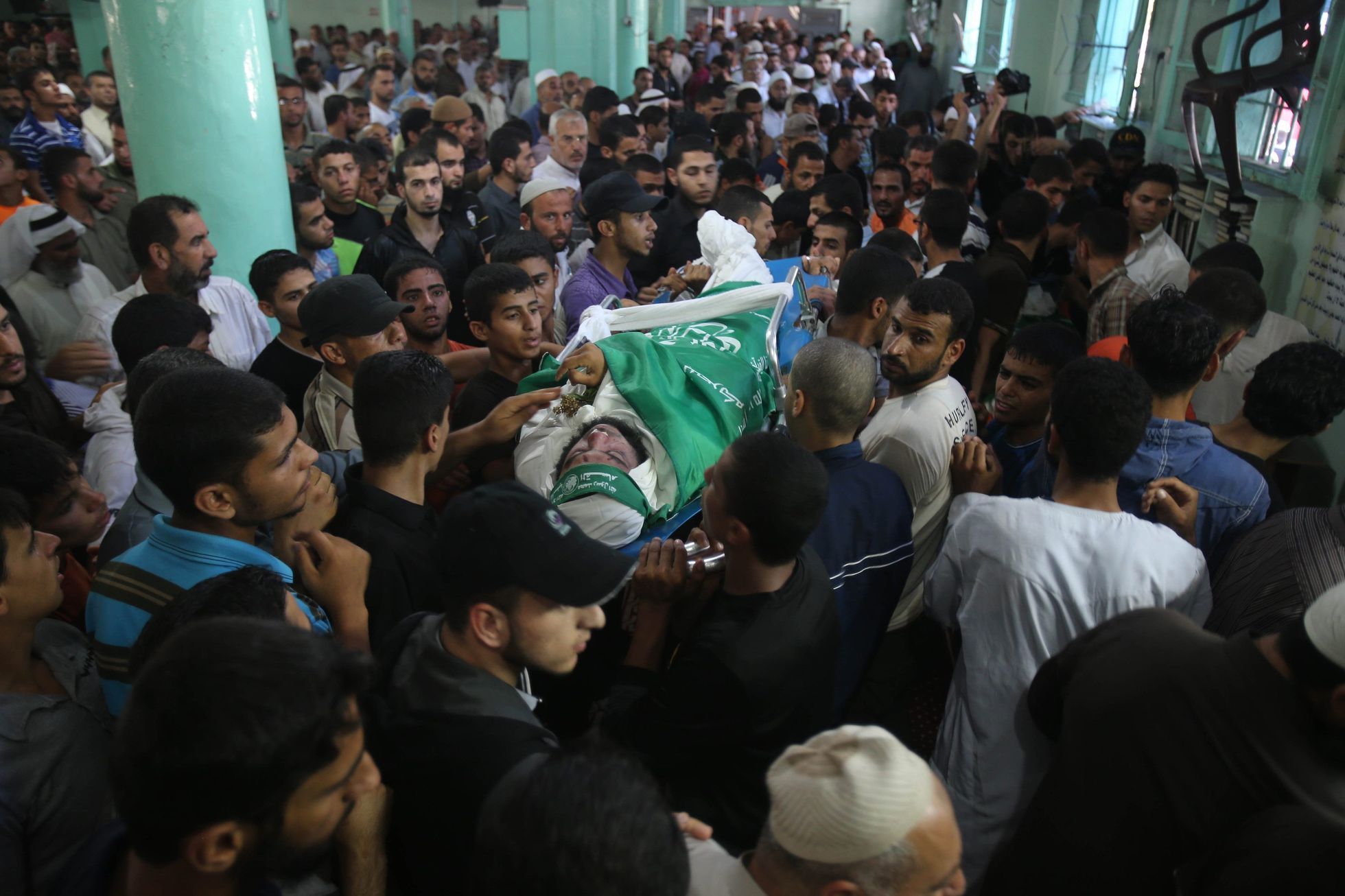 Mourners carry the body of a Hamas militant during his funeral in Rafah in the southern Gaza Strip