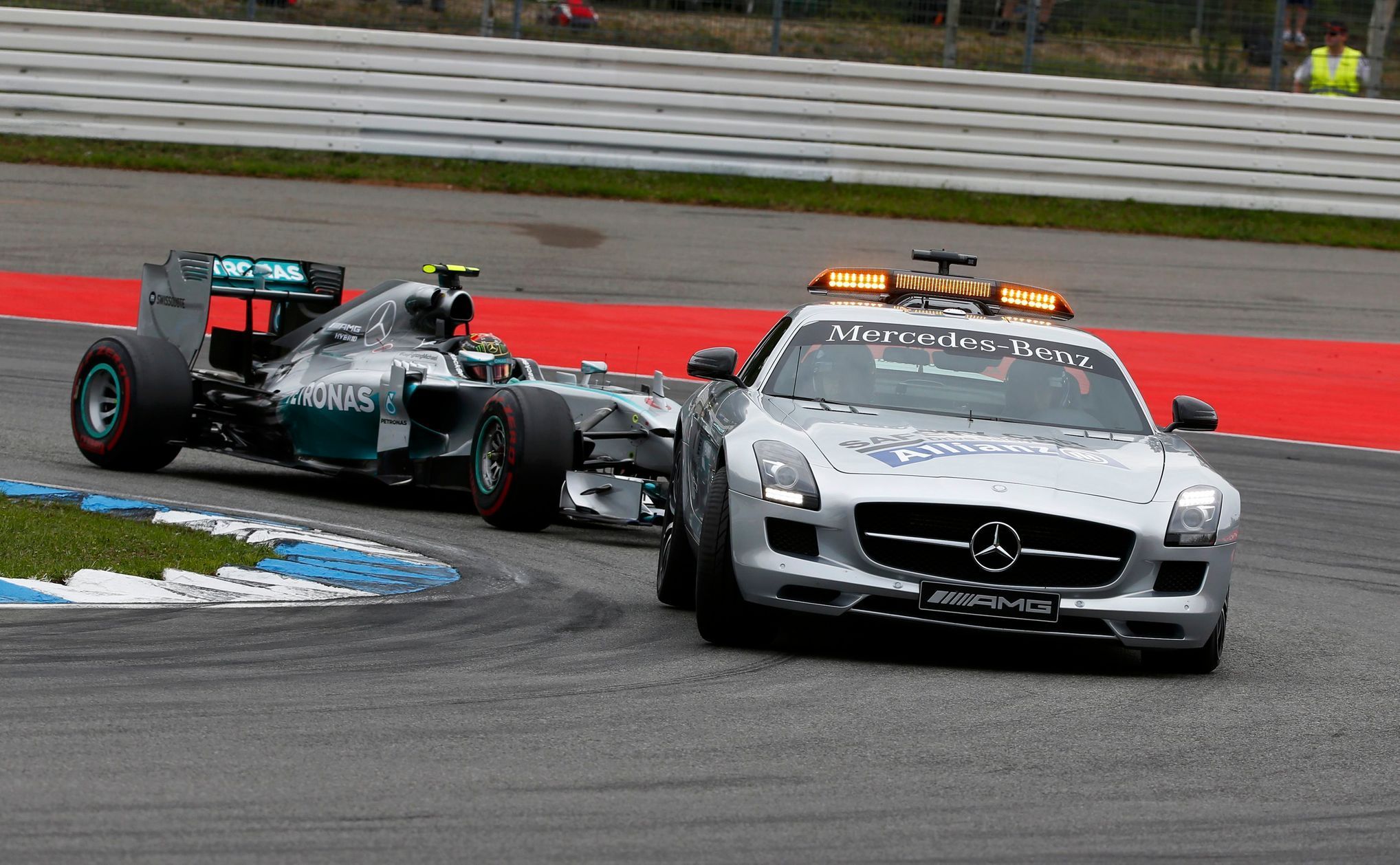 The safety car drives in front of Mercedes Formula One driver Nico Rosberg of Germany before German F1 Grand Prix at Hockenheim