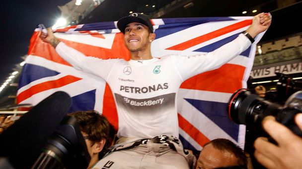 Mercedes Formula One driver Lewis Hamilton of Britain celebrates with his team after winning the Abu Dhabi F1 Grand Prix at the Yas Marina circuit in Abu Dhabi