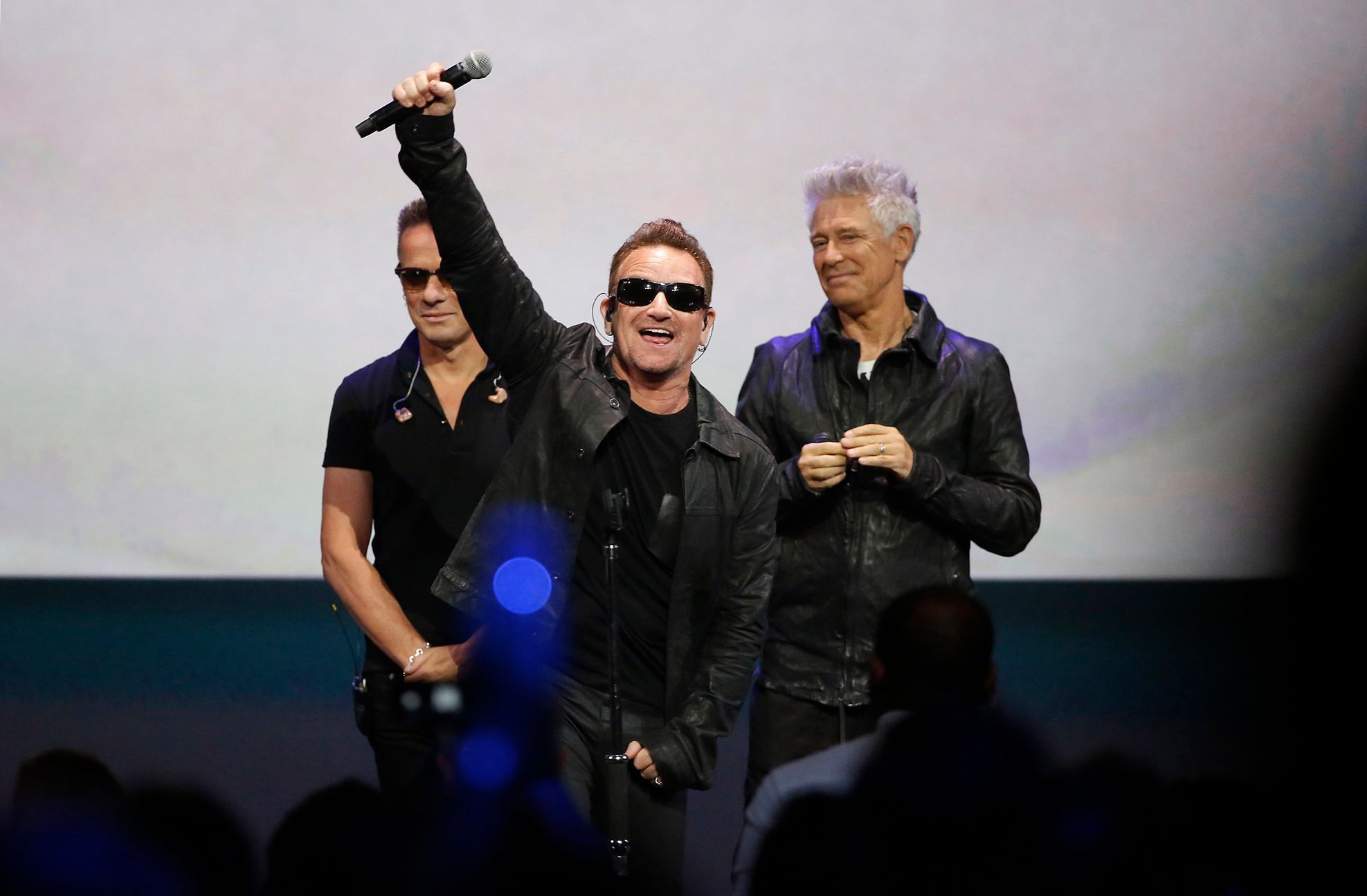 Bono of Irish rock band U2 gestures to the audience after performing at an Apple event at the Flint Center in Cupertino