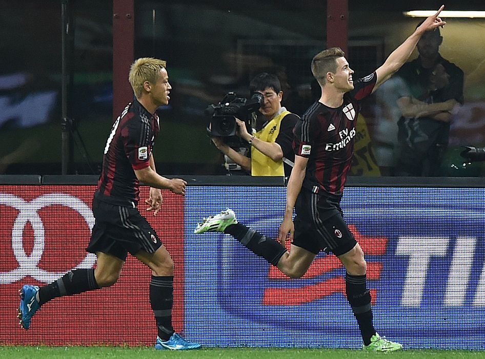AC Milan's van Ginkel celebrates after scoring a goal against AS Roma during their Serie A soccer match at the San Siro stadium in Milan