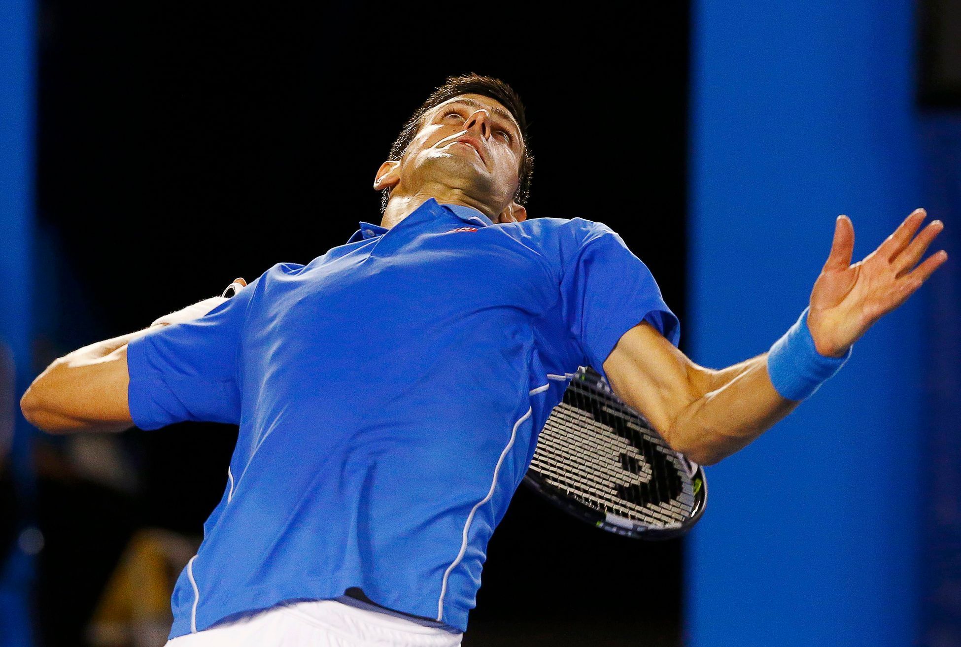 Djokovic of Serbia serves to Murray of Britain during their men's singles final match at the Australian Open 2015 tennis tournament in Melbourne