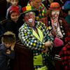 Clowns and members of the public sit in the pews of the All Saints Church during the Grimaldi clown service in Dalston, north London