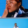 Gold medalist South Korea's Lee cries during the medal ceremony for the women's 500 meters speed skating competition at the Sochi 2014 Winter Olympic Games in Sochi