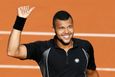 Jo-Wilfried Tsonga of France celebrates after beating Christian Lindell of Sweden during their men's singles match at the French Open tennis tournament at the Roland Garr