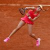 Eugenie Bouchard of Canada serves to Carla Suarez Navarro of Spain during their  women's quarter-final match at the French Open Tennis tournament at the Roland Garros stadium in Paris