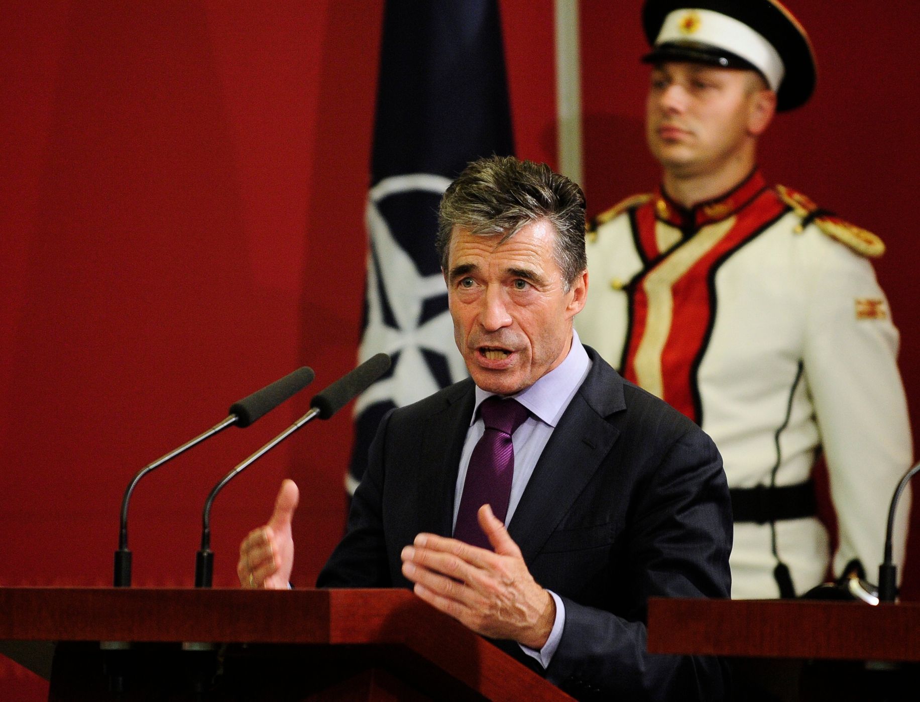 NATO Secretary-General Anders Rasmussen gestures during a news conference in Skopje