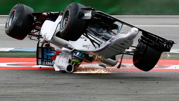 Williams Formula One driver Massa of Brazil crashes with his car in the first corner after the start of the German F1 Grand Prix at the Hockenheim racing circuit
