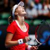 Makarova of Russia celebrates after defeating Halep of Romania in their women's singles quarter-final match at the Australian Open 2015 tennis tournament in Melbourne