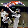 Mercedes Formula One driver Lewis Hamilton of Britain waves the Union flag, commonly known as the Union Jack, in celebration as he enters the pit lane after winning the Abu Dhabi F1 Grand Prix at the