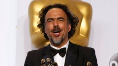 &quot;Birdman&quot; Director Alejandro Inarritu poses with the Oscars for Best Director, Best Original Screenplay and Best Picture backstage at the 87th Academy Awards in Hollywood