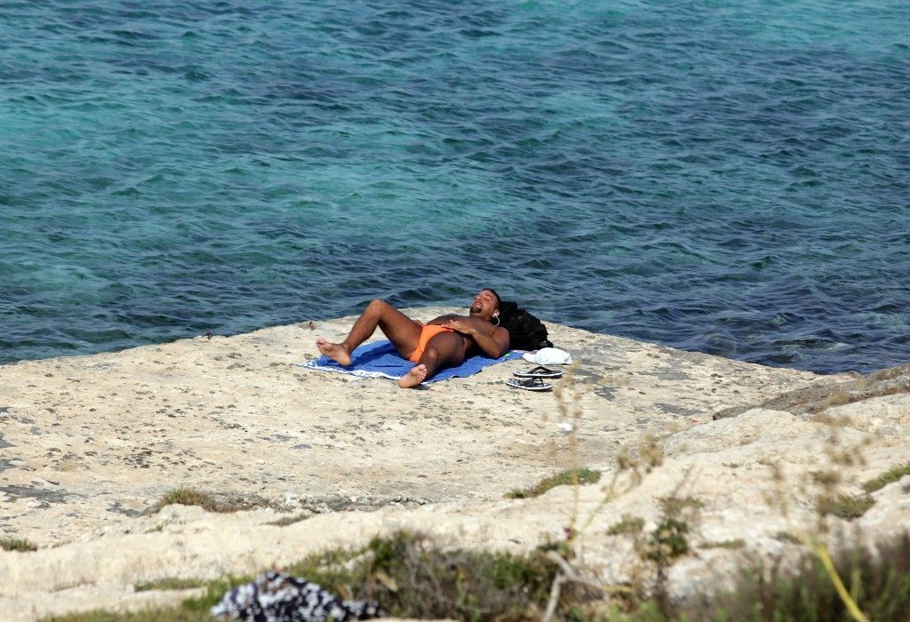 Turisté versus migranti na Lampeduse