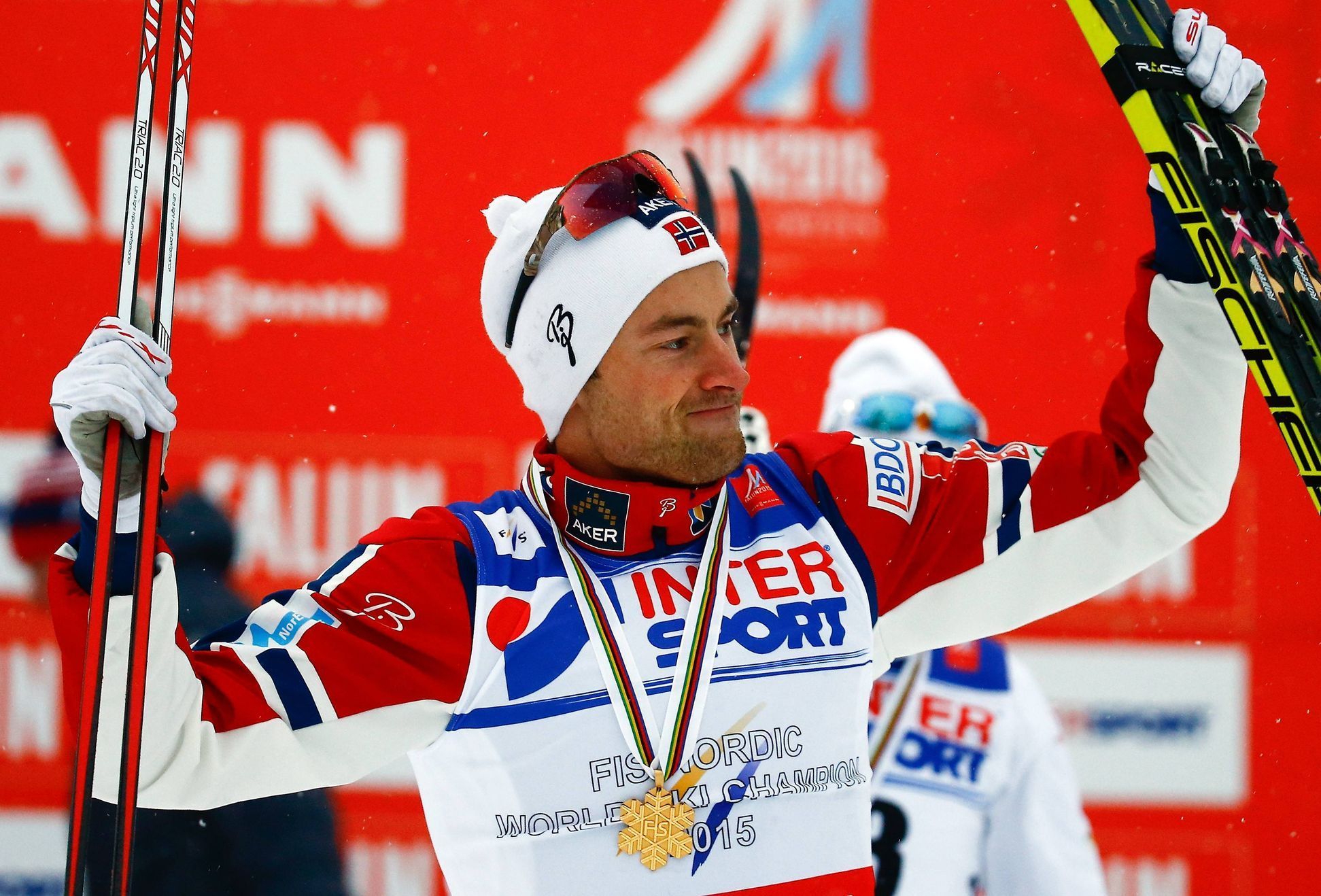 Norway's Northug celebrates winning the men's cross country 50 km mass start classic race at the Nordic World Ski Championships in Falun