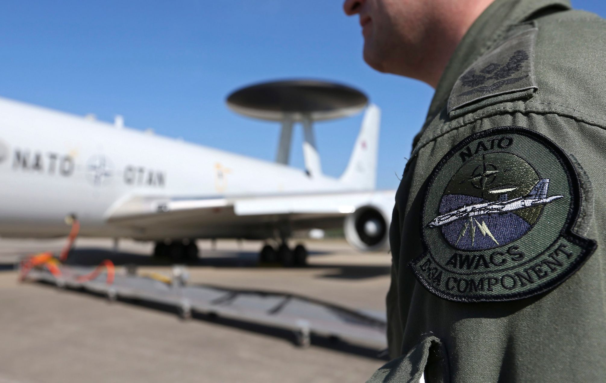 The patch of the NATO AWACS aircraft is seen attached to the uniform of an officer before boarding for a surveillance flight over Romania from the AWACS air base in Geilenkirchen near the German-Dutch