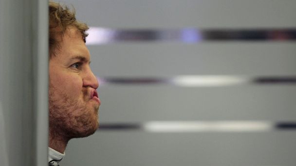 Red Bull Formula One driver Sebastian Vettel of Germany reacts during the first practice session of the Bahrain F1 Grand Prix at the Bahrain International Circuit (BIC) in Sakhir