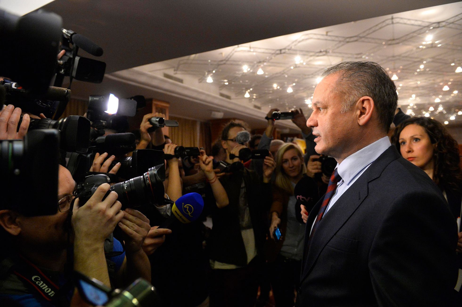 Candidate for the presidential election Andrej Kiska addresses journalists after the first unofficial results at a party election centre in Bratislava