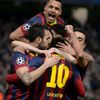 Barcelona players celebrate Lionel Messi's penalty against Manchester City during their Champions League round of 16 first leg soccer match at the Etihad Stadium in Manchester