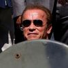 Cast member Arnold Schwarzenegger poses on a tank as they arrive on the Croisette to promote the film &quot;The Expendables 3&quot; during the 67th Cannes Film Festival in Cannes