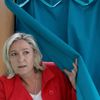 Marine Le Pen, France's National Front political party head, leaves the polling booth before casting her ballot in the European Parliament election in Henin-Beaumont