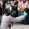Mercedes Formula One driver Nico Rosberg of Germany jokes with the cameraman to celebrate as he steps out of his car after winning the Brazilian Grand Prix in Sao Paulo