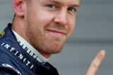Tradiční Vettelovo vítězné gesto.
