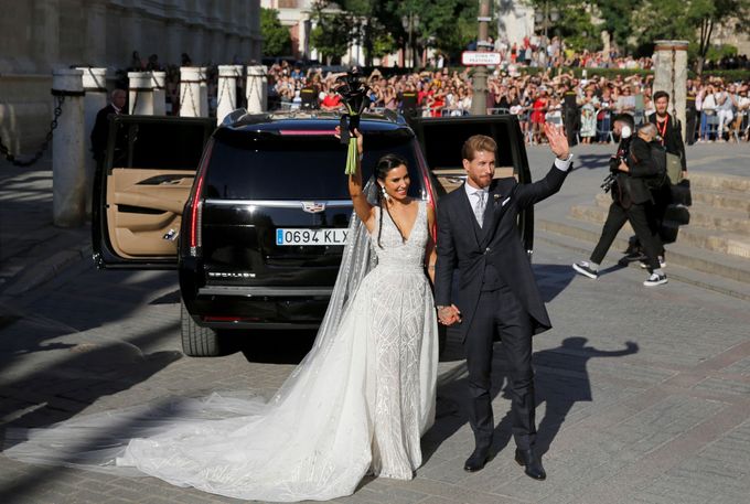 Real Madrid captain Sergio Ramos and his wife Pilar Rubio wave after their wedding at the cathedral in Seville, Spain June 15, 2019. REUTERS/Marcelo del Pozo