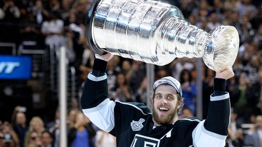 Jun 13, 2014; Los Angeles, CA, USA; Los Angeles Kings center Anze Kopitar (11) hoists the Stanley Cup after defeating the New York Rangers in game five of the 2014 Stanle