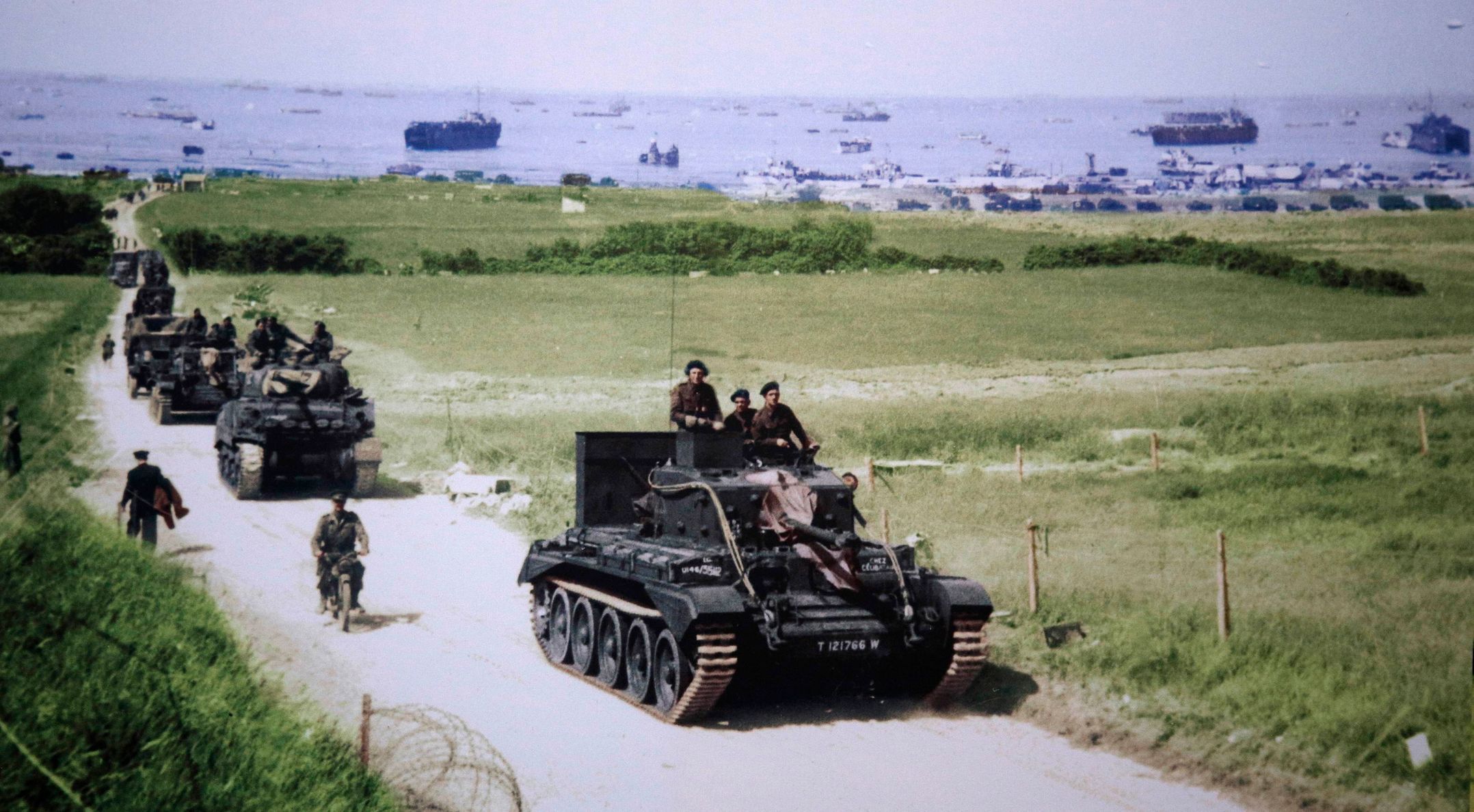 Handout photo of a Cromwell tank leading a British Army column inland from Gold Beach after landing on D-Day in Ver-sur-Mer