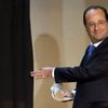 France's President Francois Hollande enters the polling booth before casting his ballot in the European Parliament election in Tulle