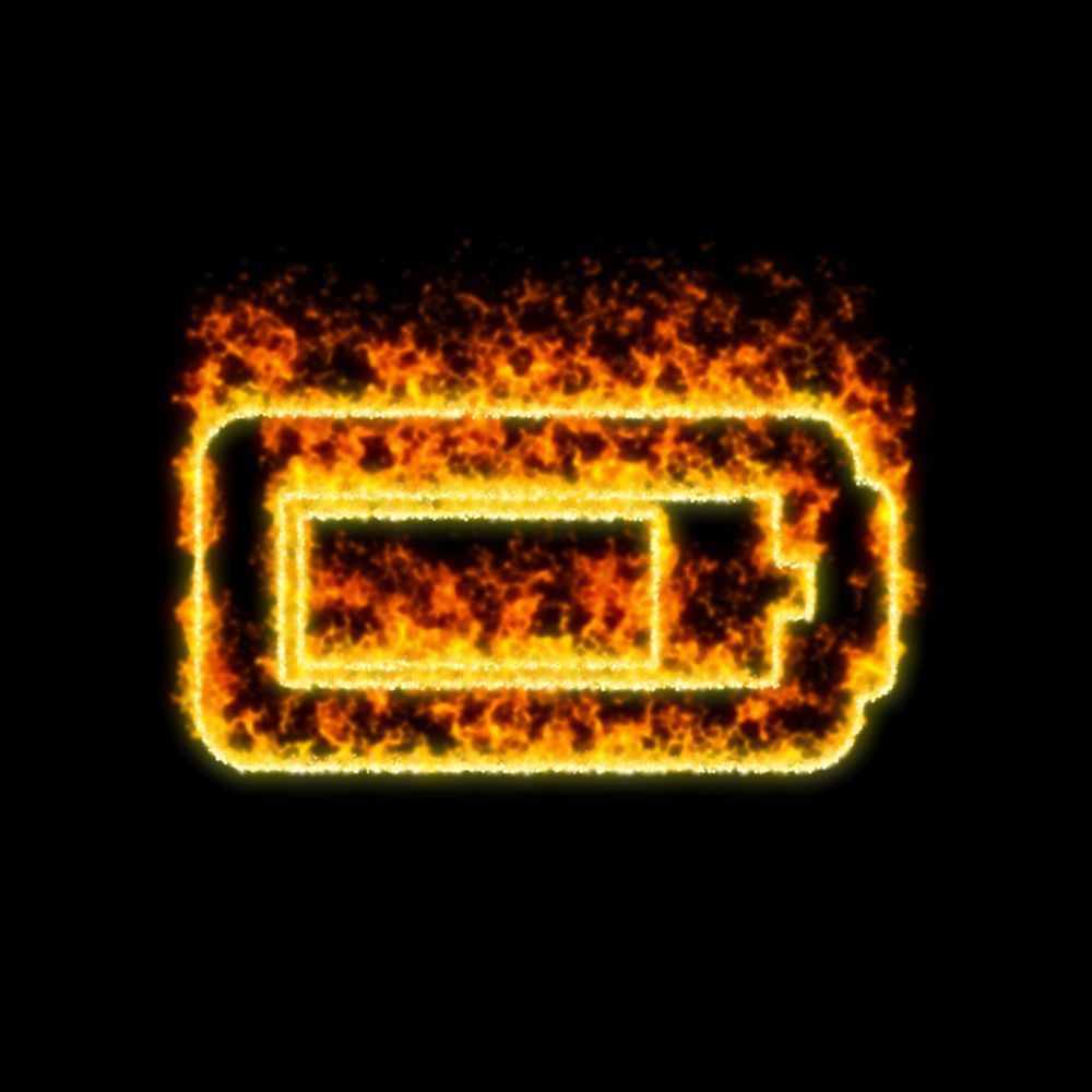 Hořící baterie symbol