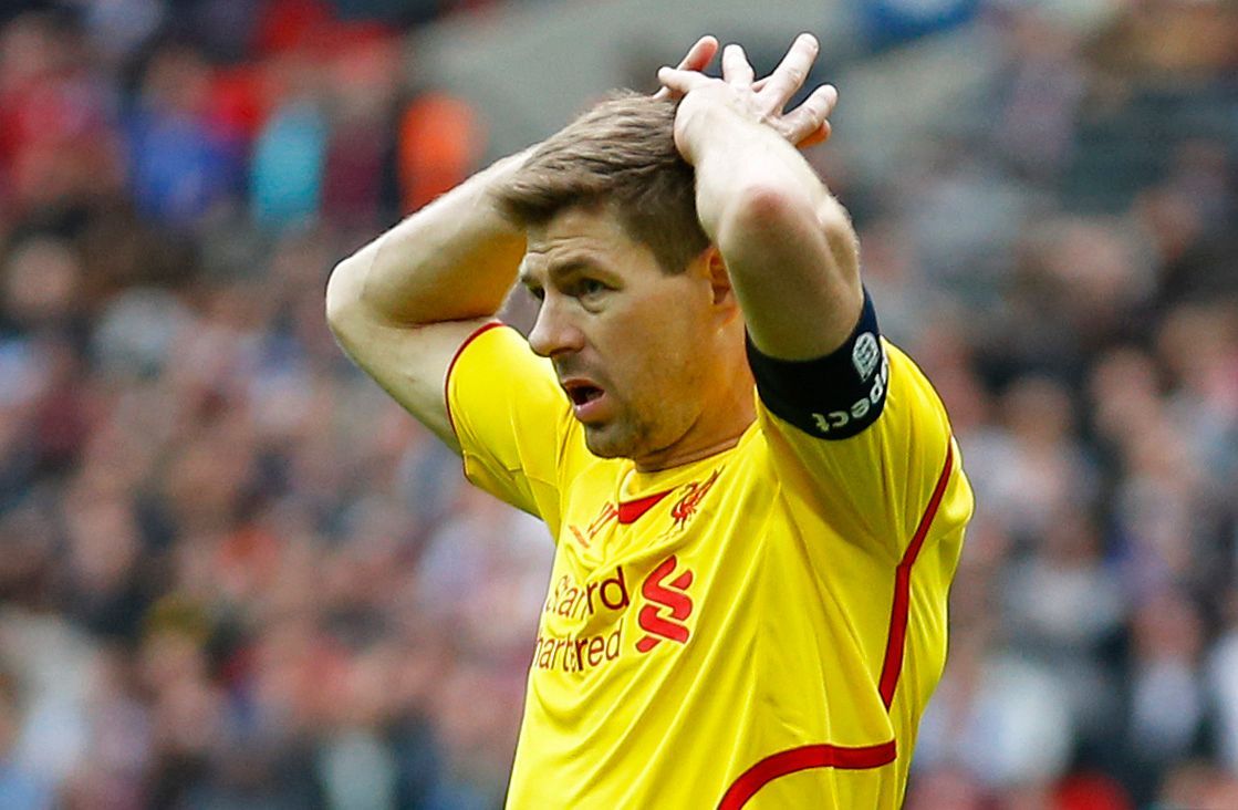 Football: Liverpool's Steven Gerrard looks dejected