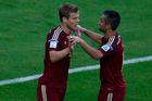Russia's Kokorin celebrates with Samedov after scoring a goal against Algeria during their 2014 World Cup Group H soccer match at the Baixada arena in Curitiba