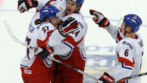 Czech Republic's Plutnar celebrates his goal against Canada with teammates Vrana and Knot during the second period of their IIHF World Junior Championship ice hockey game