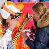 Bode Miller of the U.S. and his wife Morgan Beck cry in the mixed zone after finishing in the men's alpine skiing Super-G competition during the 2014 Sochi Winter Olympics at the Rosa Khutor Alpine Ce