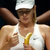 Maria Sharapova of Russia eats a banana as she rests between games against Petra Kvitova of the Czech Republic at the Singapore Indoor Stadium