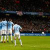 Barcelona's Lionel Messi takes a free kick against Manchester City during their Champions League round of 16 first leg soccer match at the Etihad Stadium in Manchester