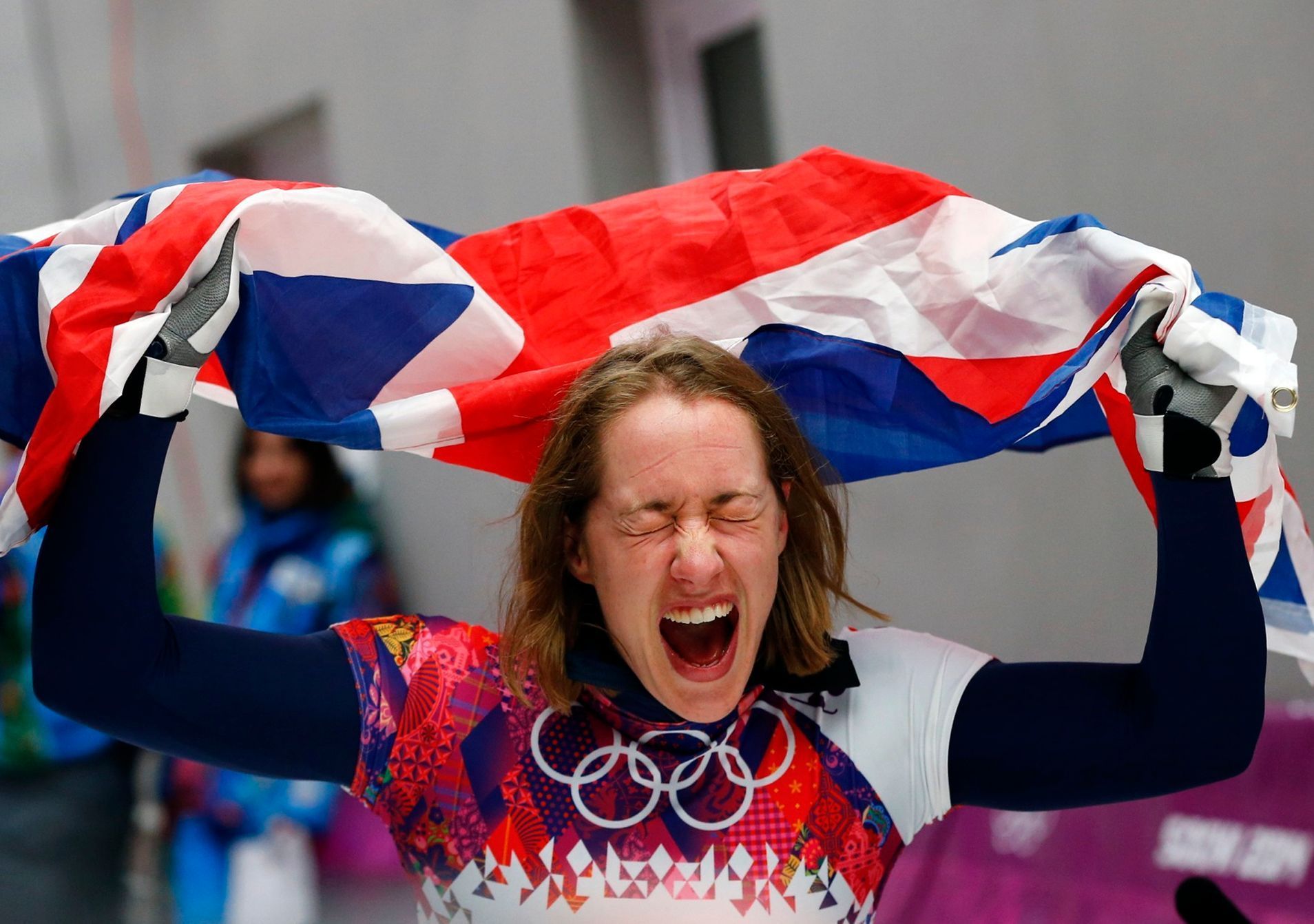 Britain's Elizabeth Yarnold celebrates with the Union flag after winning the women's skeleton event at the Sochi 2014 Winter Olympics
