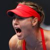 Sharapova of Russia reacts after winning a point against Bouchard of Canada during their women's singles quarter-final match at the Australian Open 2015 tennis tournament in Melbourne