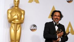 Director Alejandro Inarritu poses with the Oscars for Best Director, Best Original Screenplay and Best Picture at the 87th Academy Awards in Hollywood, California