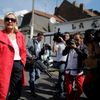 Marine Le Pen, France's National Front political party head, is surrounded by journalists after leaving a polling station during the European Parliament election in Henin-Beaumont