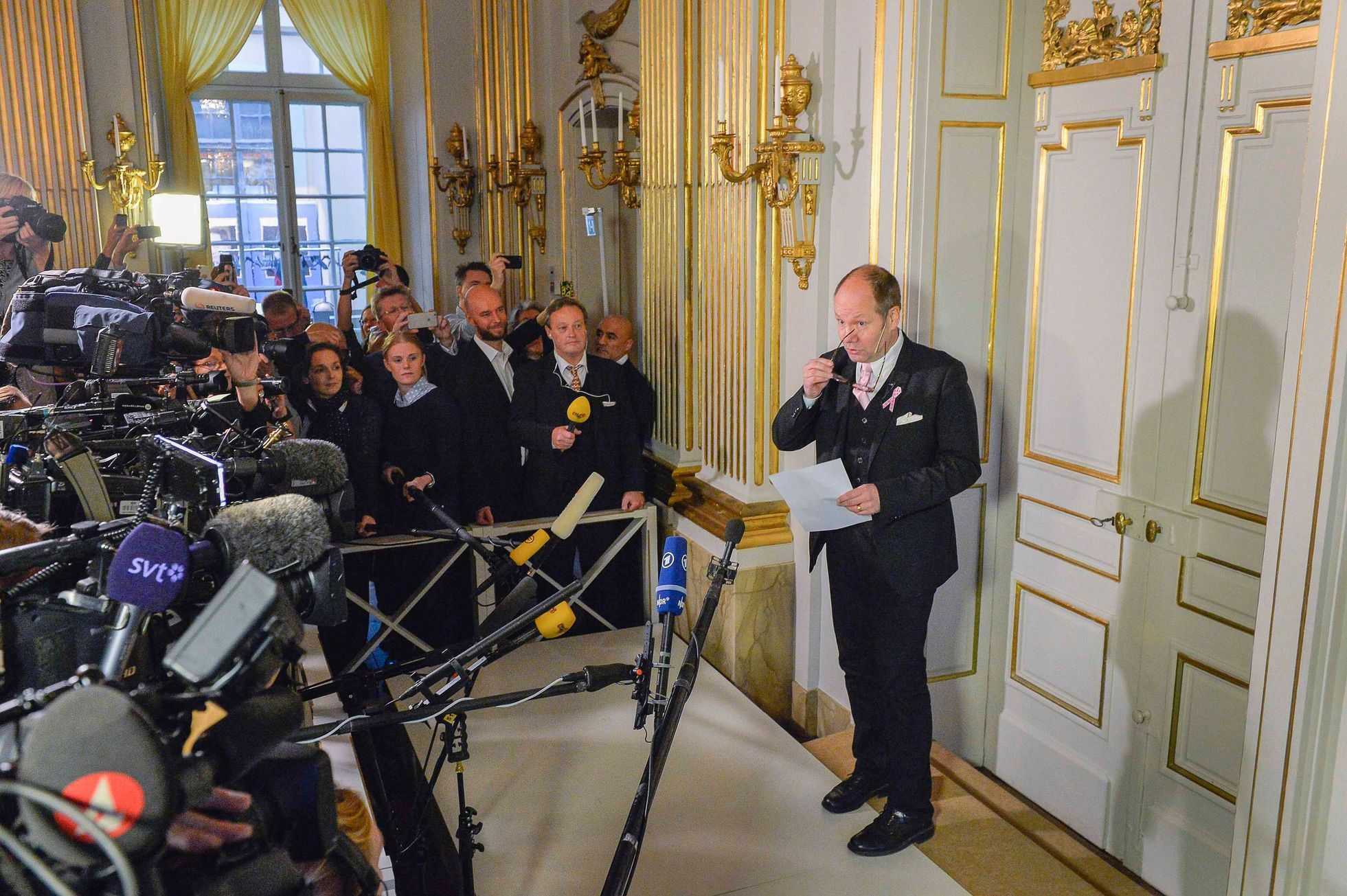 Englund, permanent secretary of the Swedish Academy, steps out of his office to announce French writer Modiano as the winner of the Nobel Prize for Literature in Stockholm