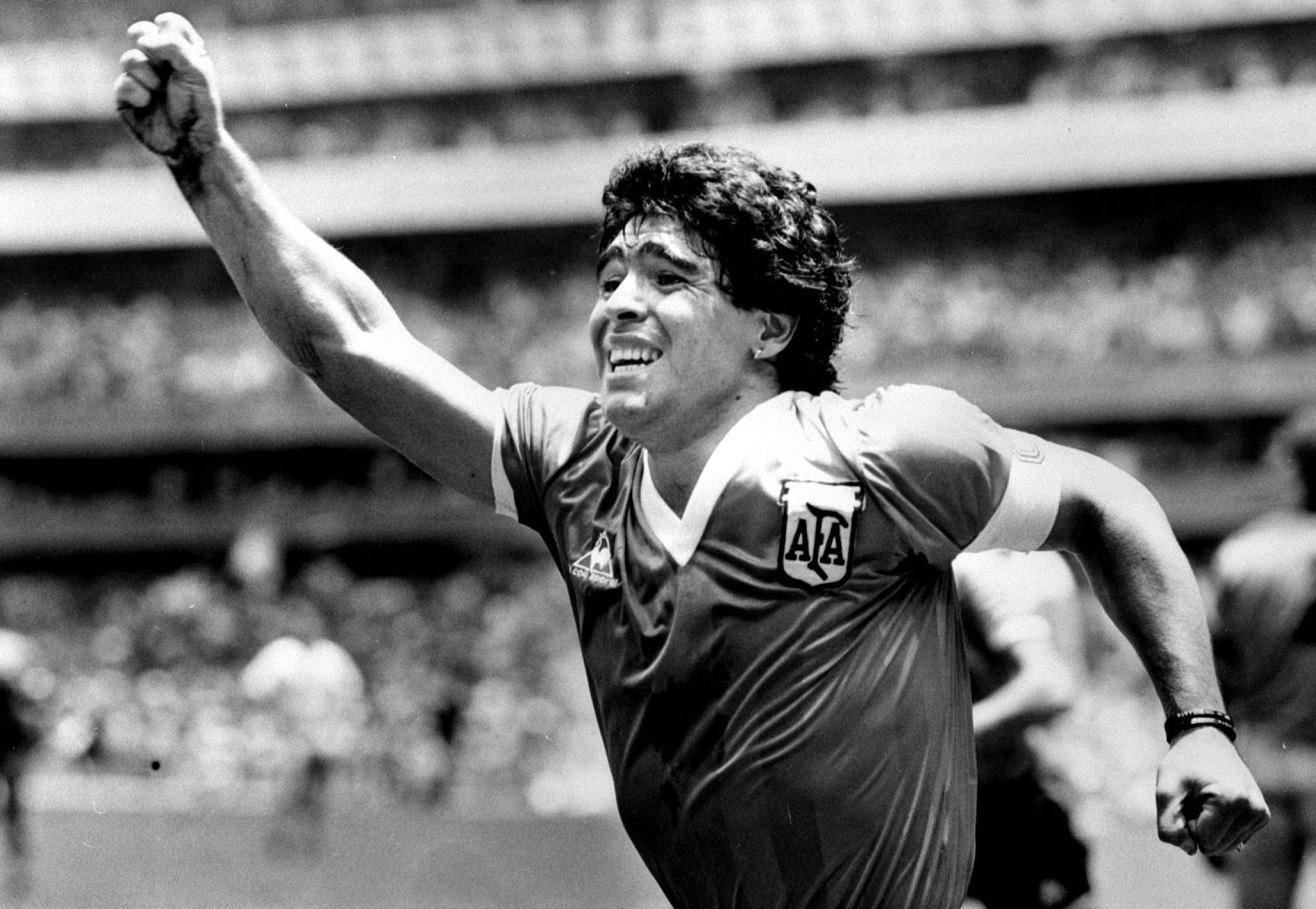 FILE PHOTO: Argentinian star Diego Maradona raises his arm in the air after scoring