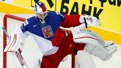 Goalie Alexander Salak of the Czech Republic (top) avoids a collision with Sweden's Dick Axelsson (bottom) during the first period of their men's ice hockey World Champio