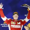 Ferrari Formula One driver Raikkonen of Finland celebrates on the podium after he placed third in the Singapore F1 Grand Prix
