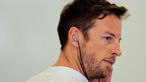 McLaren Formula One driver Jenson Button of Britain looks on during the first practice session of the Bahrain F1 Grand Prix at the Bahrain International Circuit (BIC) in