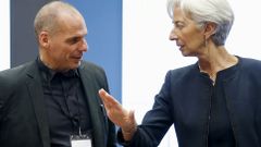 Greek Finance Minister Varoufakis listens to IMF Managing Director Lagarde during an euro zone finance ministers meeting in Luxembourg