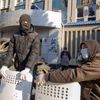Pro-Russian protesters gather at a barricade outside the offices of the SBU state security service in Luhansk